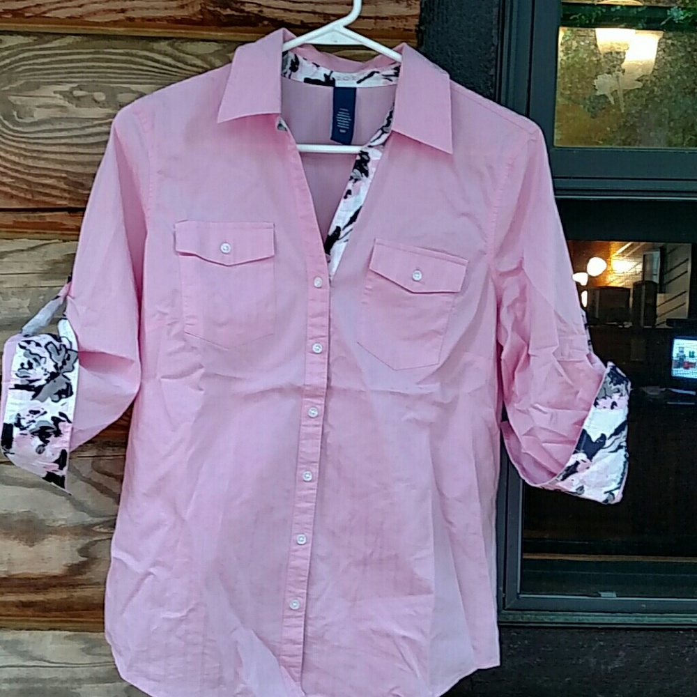 Pretty pink button down shirt, fold-up sleeves.